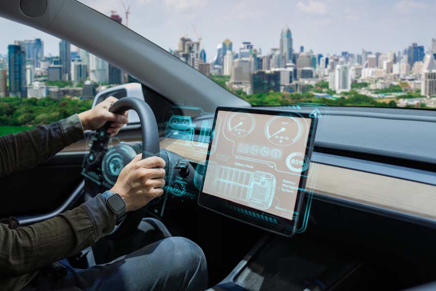 electrical-car Person driving EV car with a large city ahead