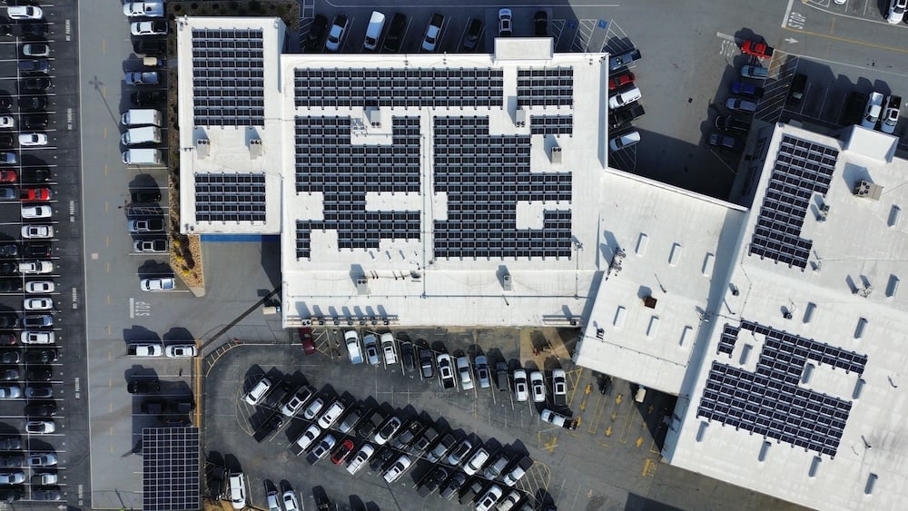 Akins Ford overview shot with solar panels on top of the building