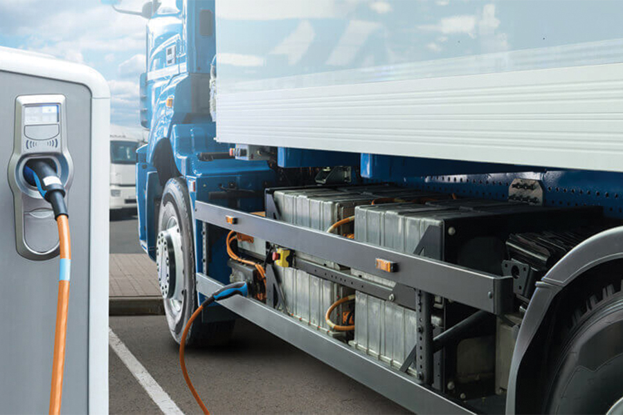 A SemiTruck charging at an electric vehicle charging station