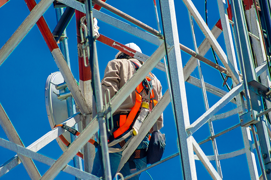 Person climbing a cell tower